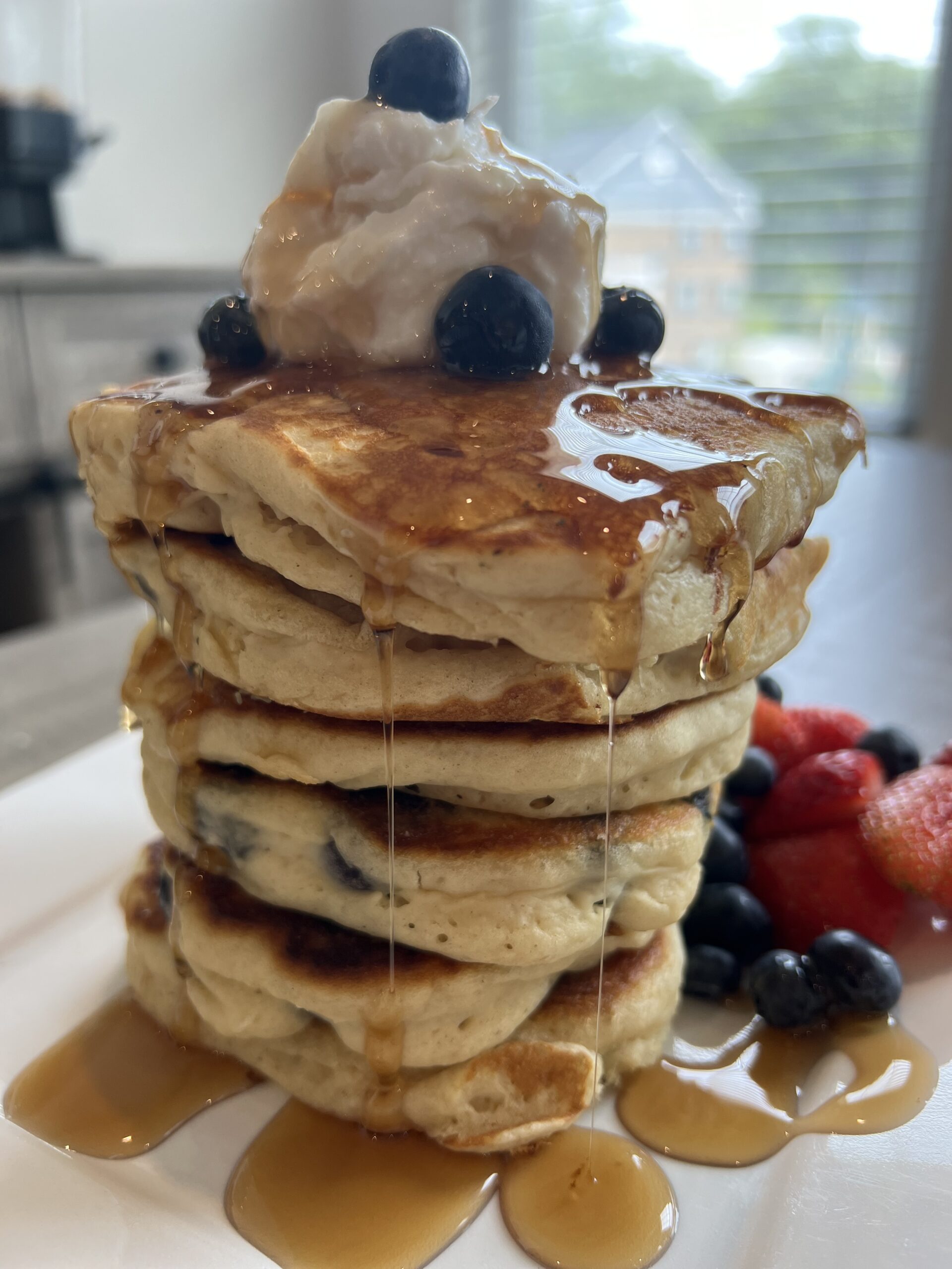 Blueberry Lemon Ricotta Pancakes with Fruit and Syrup